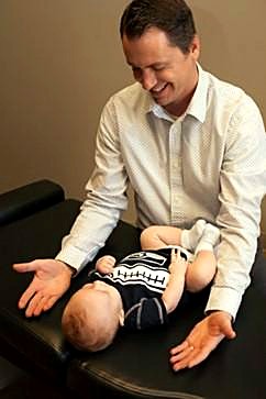 One of our doctors giving a gentle pediatric adjustment